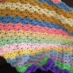 kafesli-cicekten-renkli-tig-battaniye
